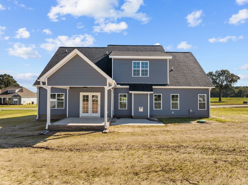 Front exterior of a new home in Kennedy's Crossing, Grimesland, NC, highlighting curb appeal (Image 2). Front exterior of a new home in Kennedy's Crossing, Grimesland, NC, highlighting curb appeal (Image 2).