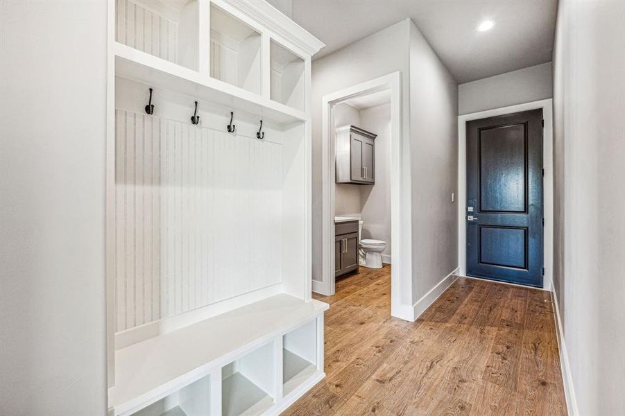 Mudroom with hardwood / wood-style flooring