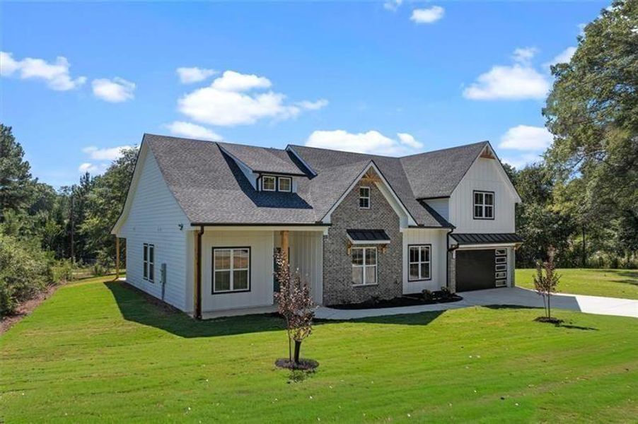 Front exterior of a new home in , Powder Springs, GA, highlighting curb appeal (Image 30).