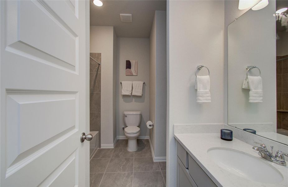 Furnished interior view inside a new home in Sunterra, Katy (Image 14).