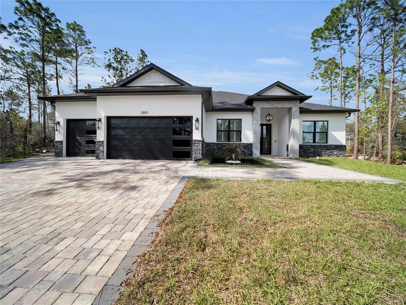 Front exterior of a new home in , Dunnellon, FL, highlighting curb appeal (Image 1). Front exterior of a new home in , Dunnellon, FL, highlighting curb appeal (Image 1).