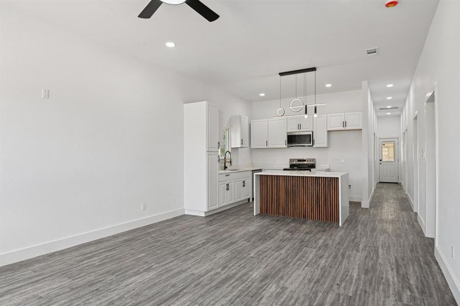 Foyer featuring wood finished floors and baseboards Foyer featuring wood finished floors and baseboards