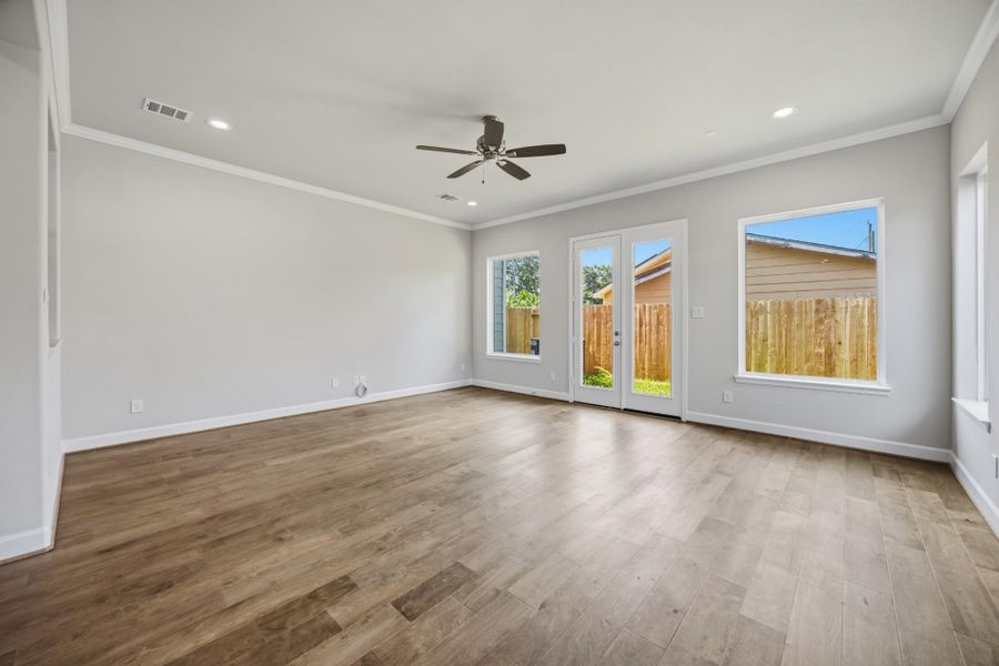 Design your ideal living space with room for multiple furniture groupings in this expansive area.