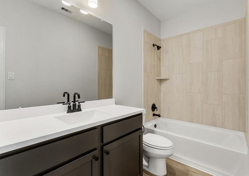 The secondary bathroom with designer details