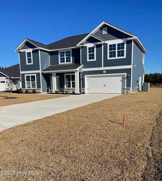 Front exterior of a new home in Athens Acres, New Bern, NC, highlighting curb appeal (Image 1). Front exterior of a new home in Athens Acres, New Bern, NC, highlighting curb appeal (Image 1).