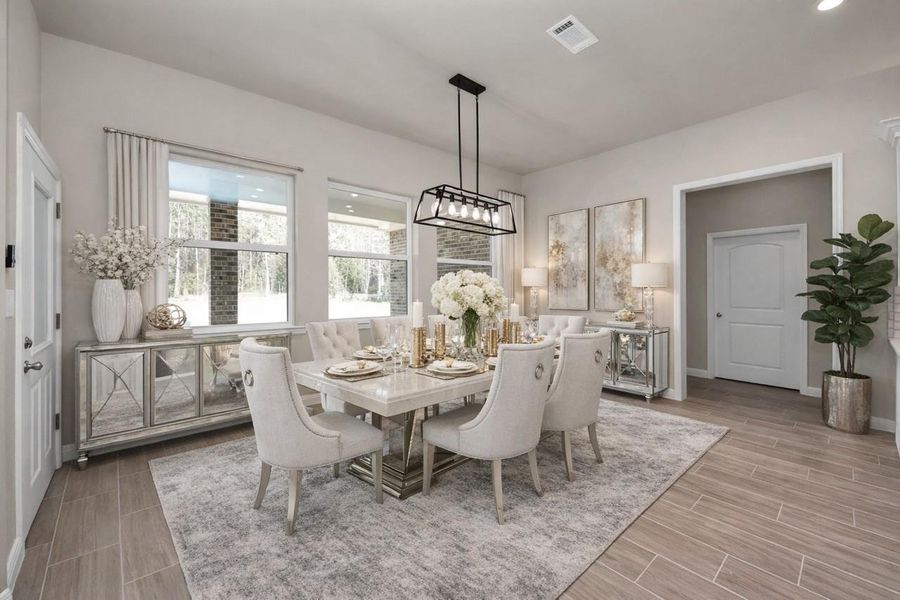 This is the spacious breakfast nook right off the kitchen. When going down this hallway, you will find a secondary bedroom with its own ensuite bath, the utility room, mud room, powder room, and office which could serve as a fifth bedroom.