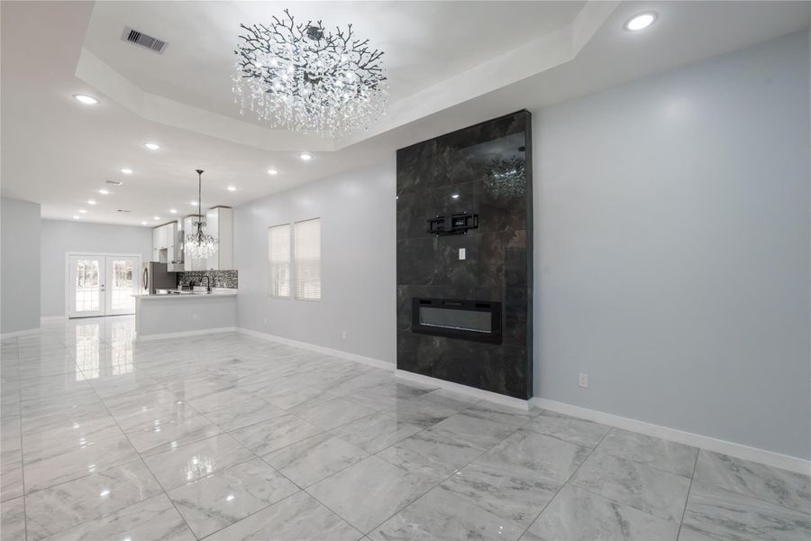 Beautiful open living area that transitions smoothly into the dining room and kitchen.