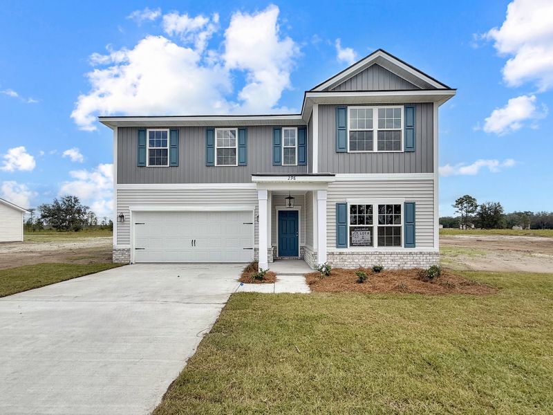 Front exterior of a new home in Tibet Road at Sassafras, Allenhurst, GA, highlighting curb appeal (Image 22).