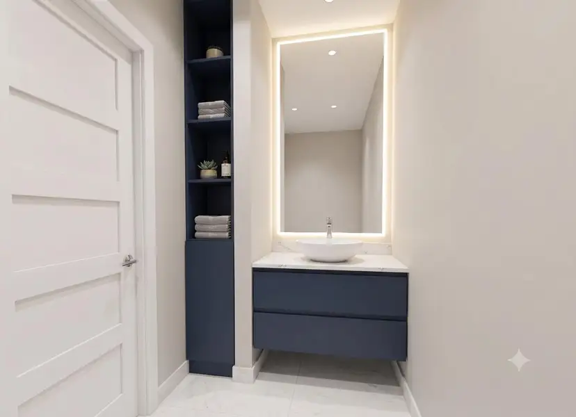 An elegant floating vanity anchors this modern powder room featuring clean lines and stone counters.