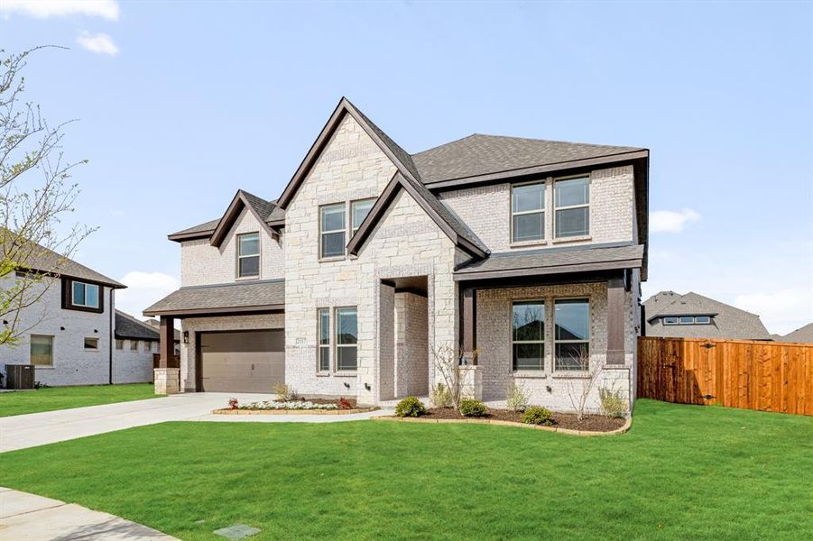 Front exterior of a new home in ArrowBrooke, Aubrey, TX, highlighting curb appeal (Image 2). Front exterior of a new home in ArrowBrooke, Aubrey, TX, highlighting curb appeal (Image 2).
