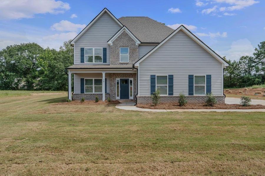 Front exterior of a new home in , McDonough, GA, highlighting curb appeal (Image 15).