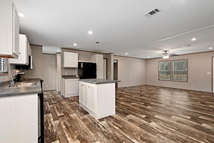 KItchen has abundance of cabinets for storage.