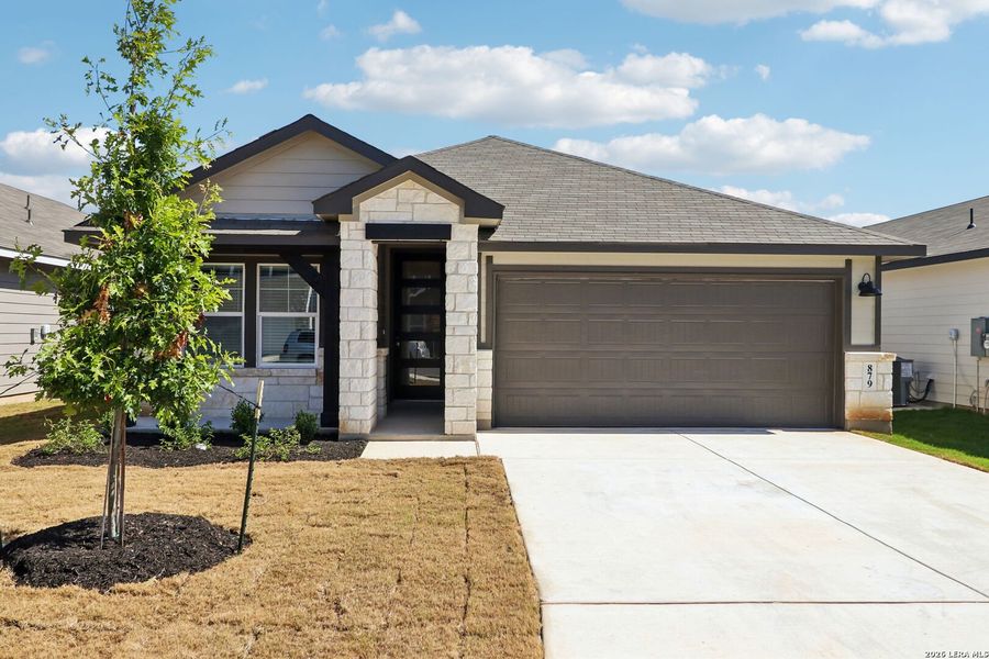 Front exterior of a new home in Estancia Ranch - Premier Series, San Antonio, TX, highlighting curb appeal (Image 26).