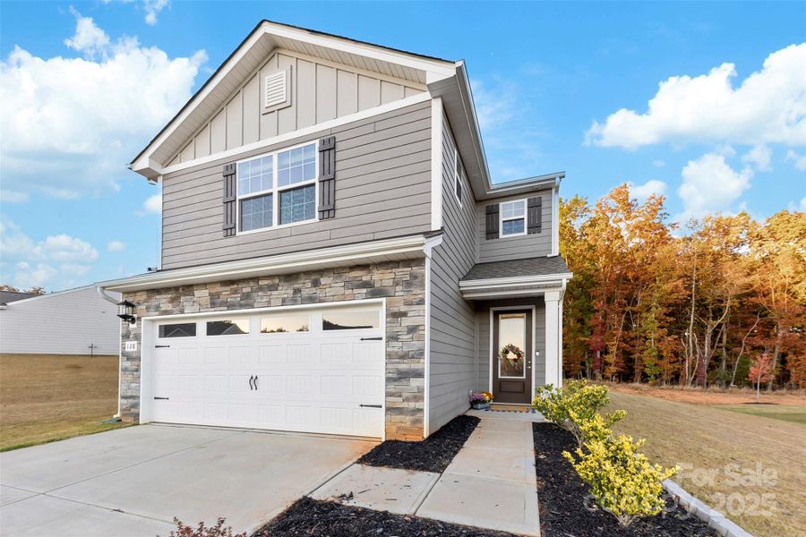 Front exterior of a new home in , Troutman, NC, highlighting curb appeal (Image 28).