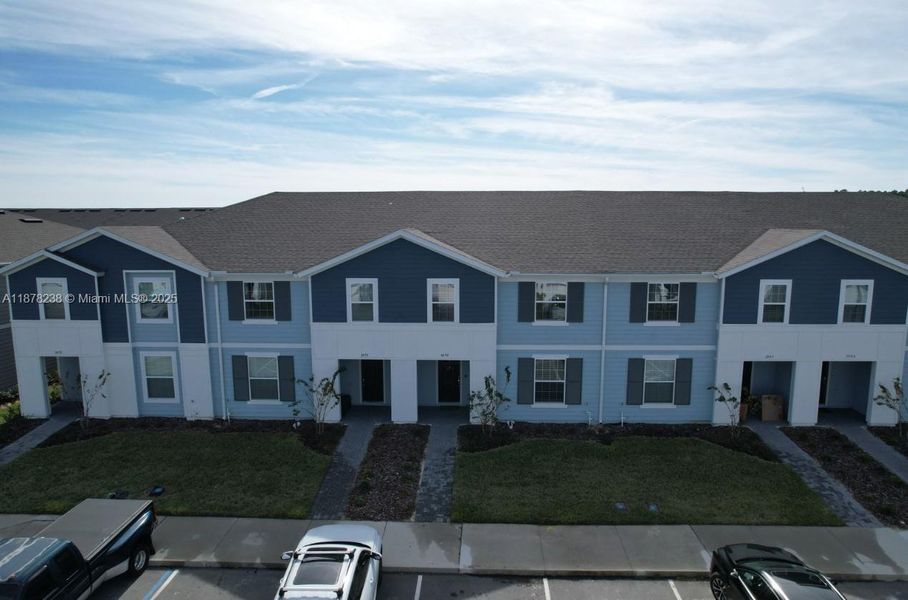 Front exterior of a new home in , Davenport, FL, highlighting curb appeal (Image 21).