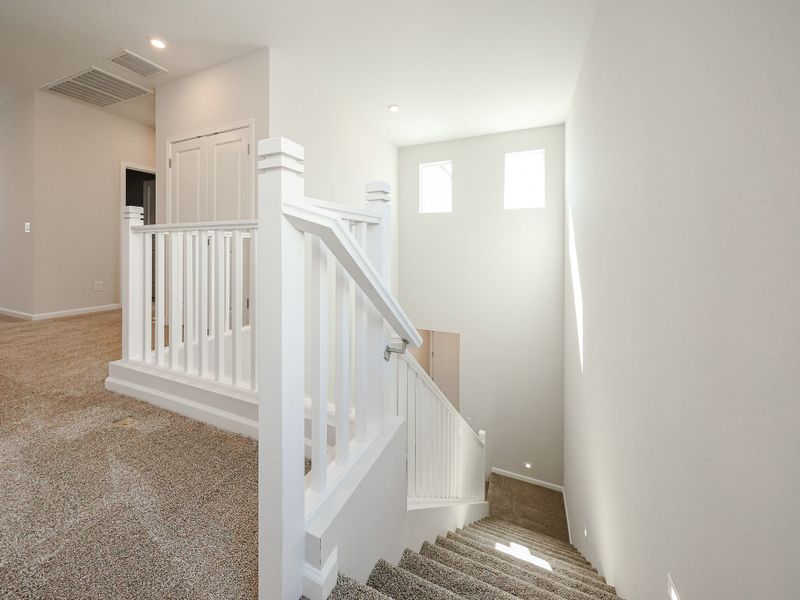A staircase in a house. A staircase in a house.
