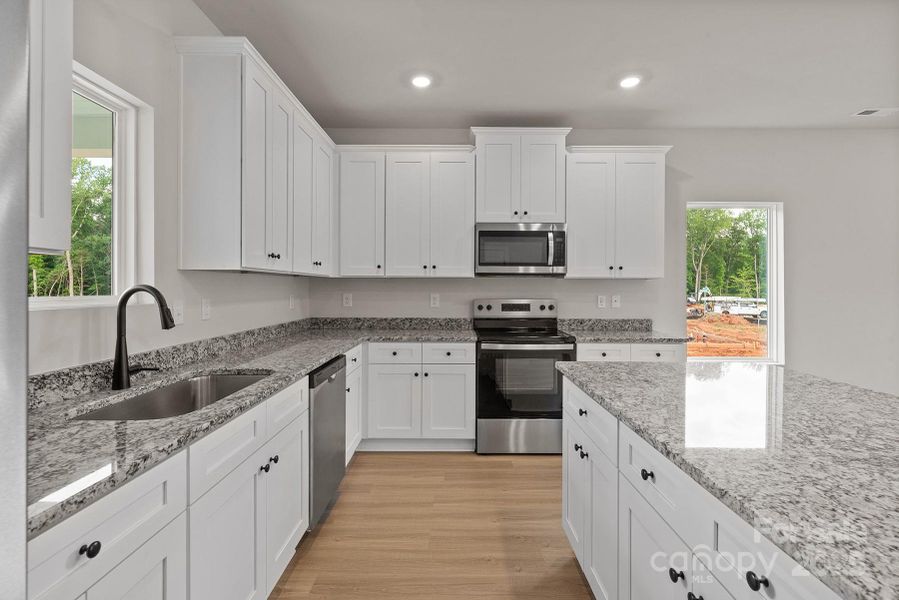 Furnished interior view inside a new home in Stagecoach Station, Gastonia (Image 8).