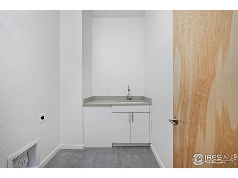 SPacious Laundry Room with Utility Sink