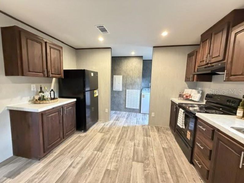 Furnished interior view inside a new home in , Chiefland (Image 3).