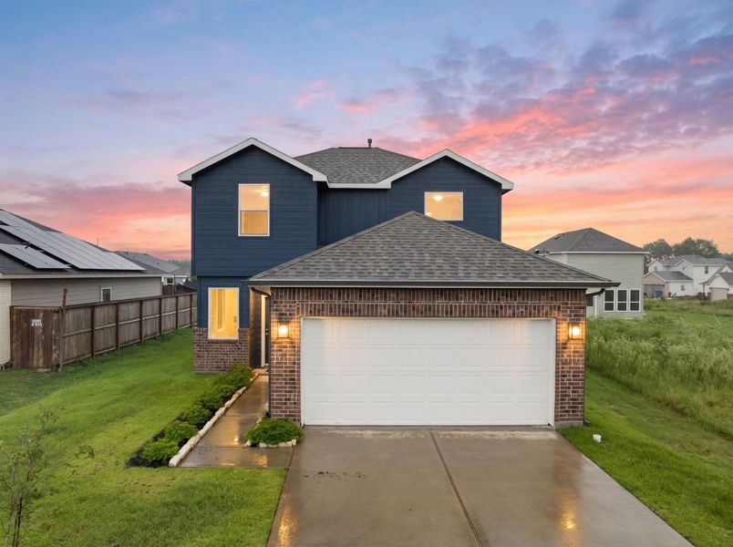 Front exterior of a new home in Santa Fe, Cleveland, TX, highlighting curb appeal (Image 1). Front exterior of a new home in Santa Fe, Cleveland, TX, highlighting curb appeal (Image 1).