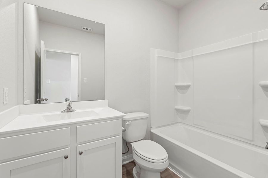 Furnished interior view inside a new home in Canterra Creek, Iowa Colony (Image 5).