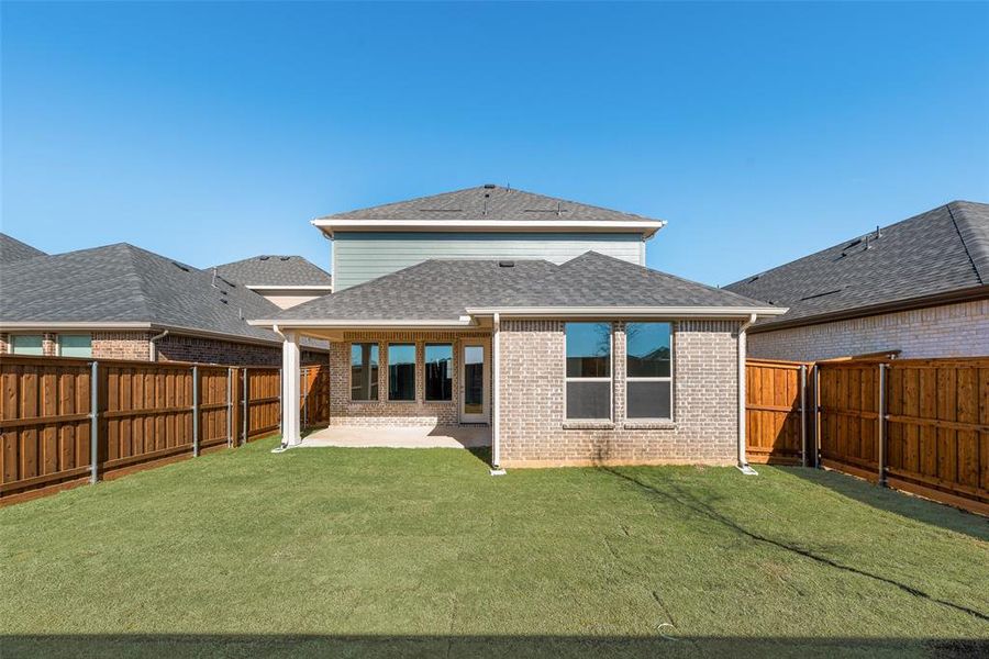 Exterior details and patio area of a home in Spiritas Ranch, Little Elm (Image 4).