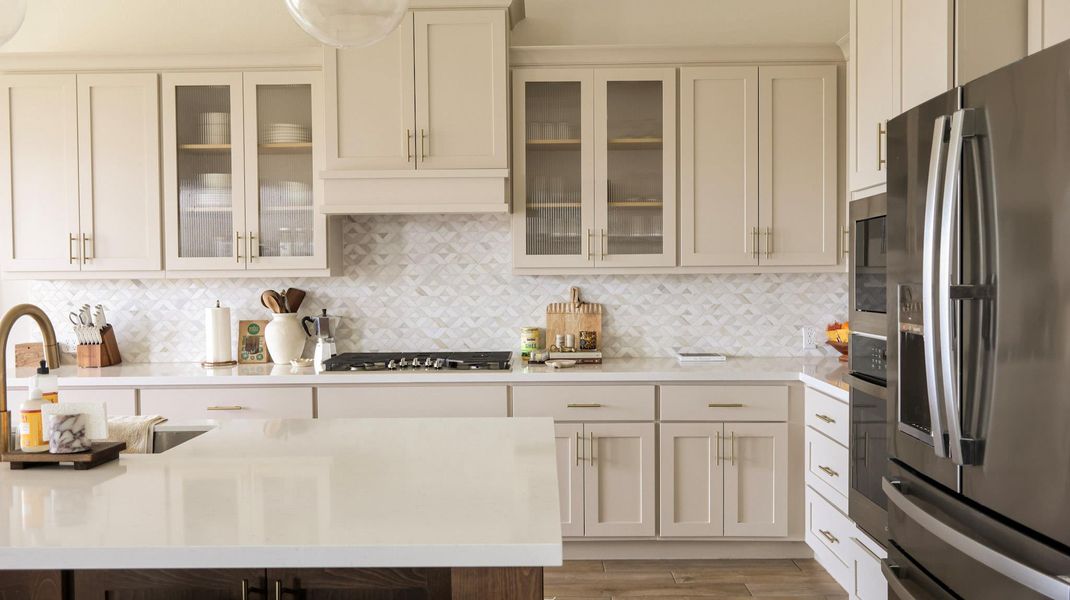 Culinary delights await in this modern kitchen with ample counter space and state-of-the-art appliances. Culinary delights await in this modern kitchen with ample counter space and state-of-the-art appliances.
