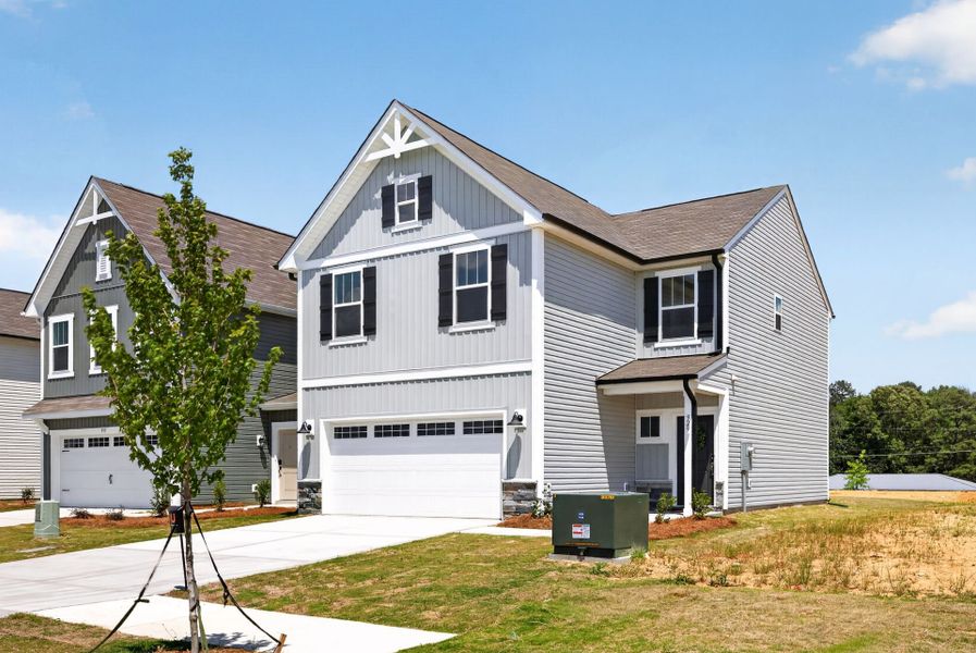 Front exterior of a new home in Shay Crossing, Salisbury, NC, highlighting curb appeal (Image 2). Front exterior of a new home in Shay Crossing, Salisbury, NC, highlighting curb appeal (Image 2).