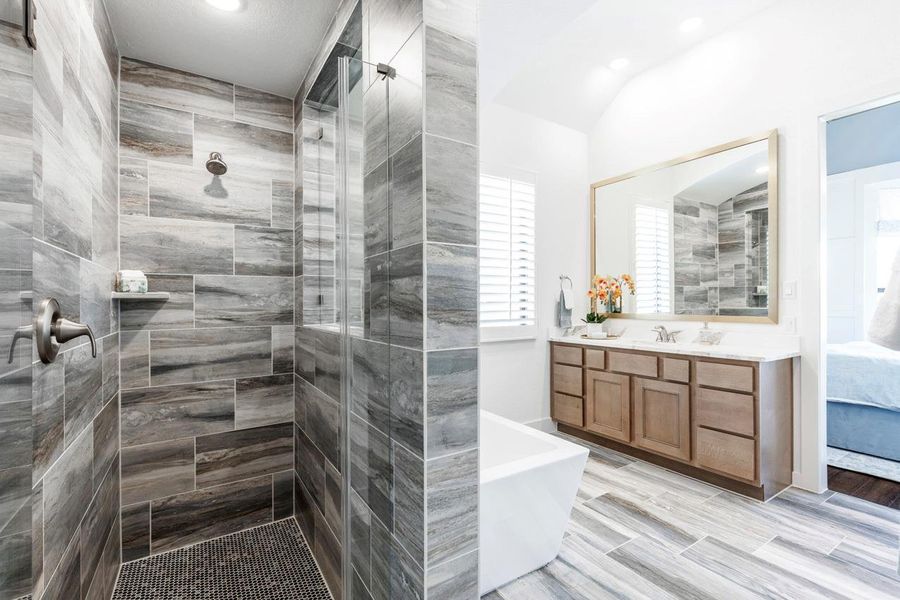 Full bath with a soaking tub, a tile shower, and vanity Full bath with a soaking tub, a tile shower, and vanity