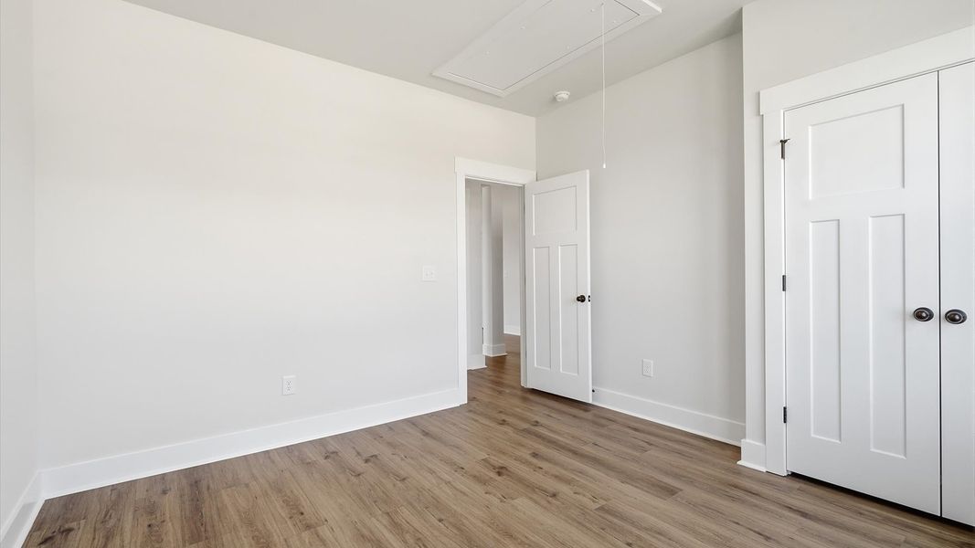 Desirable hardwood flooring in all bedrooms creates a cohesive and elegant interior Desirable hardwood flooring in all bedrooms creates a cohesive and elegant interior