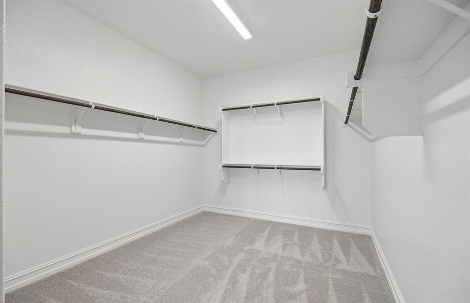 Spacious walk-in closet in primary suite
