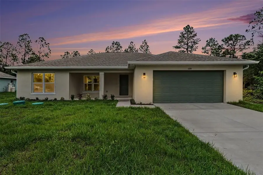 Front exterior of a new home in , North Port, FL, highlighting curb appeal (Image 20). Front exterior of a new home in , North Port, FL, highlighting curb appeal (Image 20).