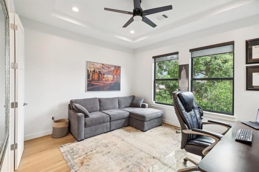 The fourth secondary bedroom is currently being used as an office. The views from this window are illustrative of the views from 3 bedrooms and the entire family room - lush with trees and greenscape.