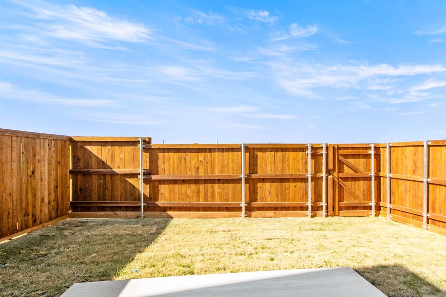 Exterior details and patio area of a home in Wildridge, Oak Point (Image 22).