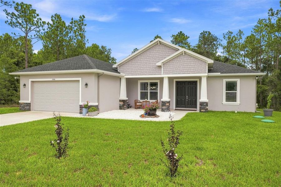 Front exterior of a new home in , Weeki Wachee, FL, highlighting curb appeal (Image 20). Front exterior of a new home in , Weeki Wachee, FL, highlighting curb appeal (Image 20).