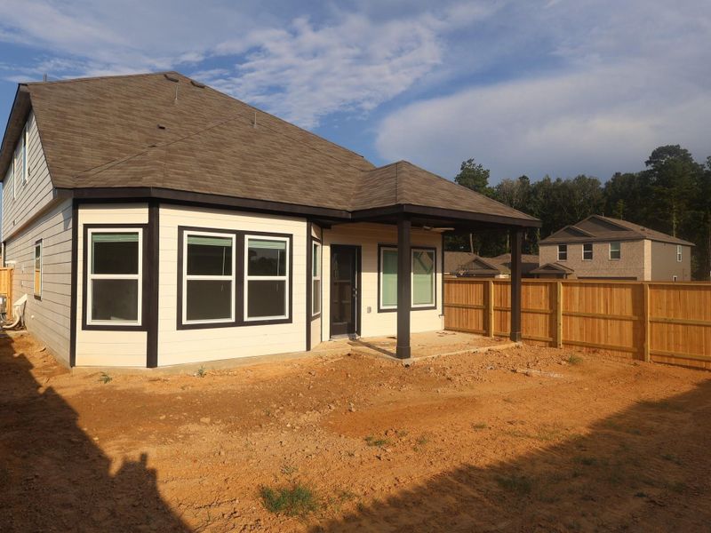 Exterior details and patio area of a home in Pinewood at Grand Texas, New Caney (Image 2). Exterior details and patio area of a home in Pinewood at Grand Texas, New Caney (Image 2).