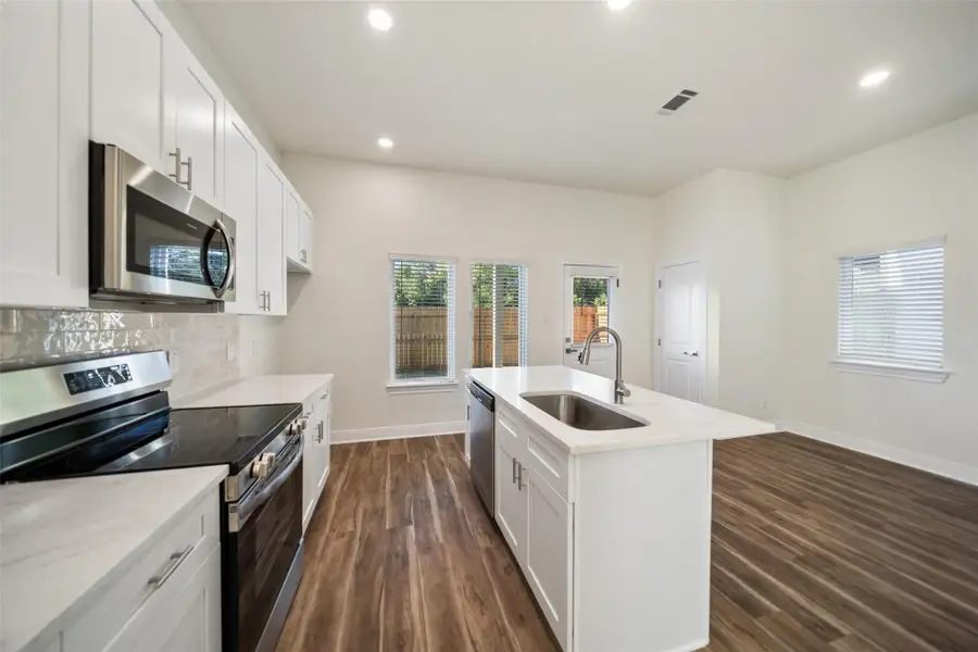 Electric oven and microwave included.