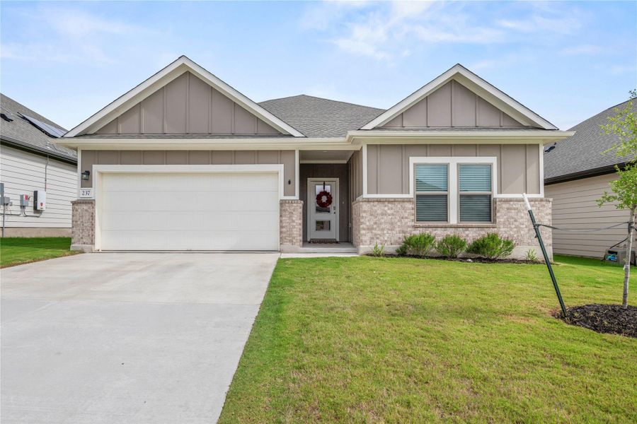 A welcoming facade with a clean driveway and well-maintained front yard. A welcoming facade with a clean driveway and well-maintained front yard.