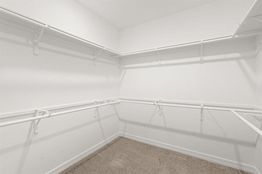 A view of your large primary walk-in Closet