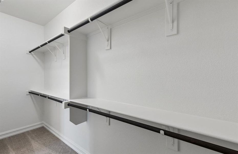 Walk in closet in primary suite Walk in closet in primary suite
