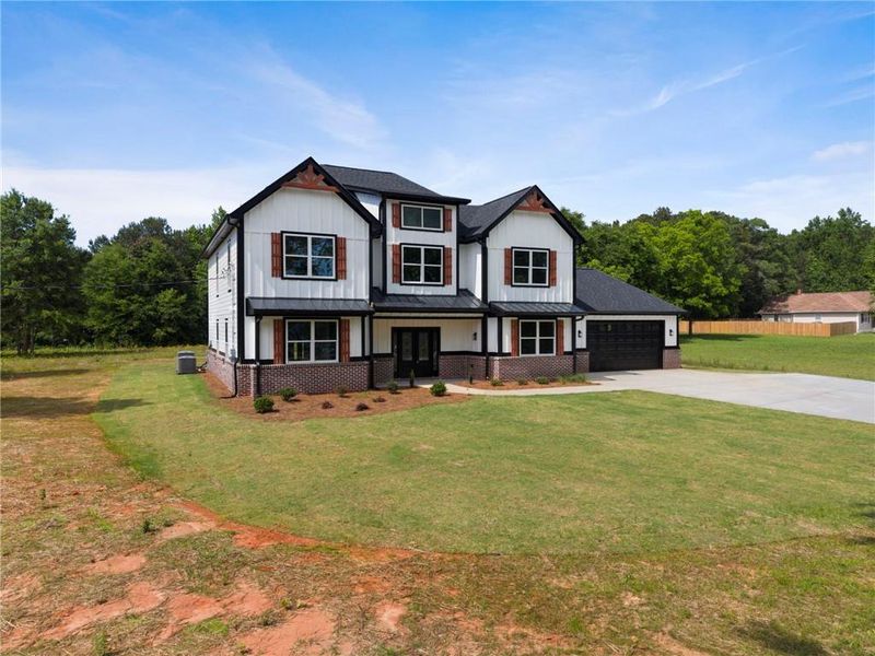 Front exterior of a new home in , Locust Grove, GA, highlighting curb appeal (Image 20).