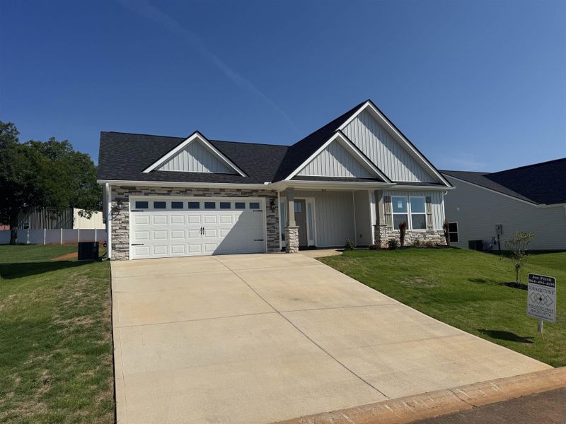 Front exterior of a new home in Davis Heights, Inman, SC, highlighting curb appeal (Image 17). Front exterior of a new home in Davis Heights, Inman, SC, highlighting curb appeal (Image 17).