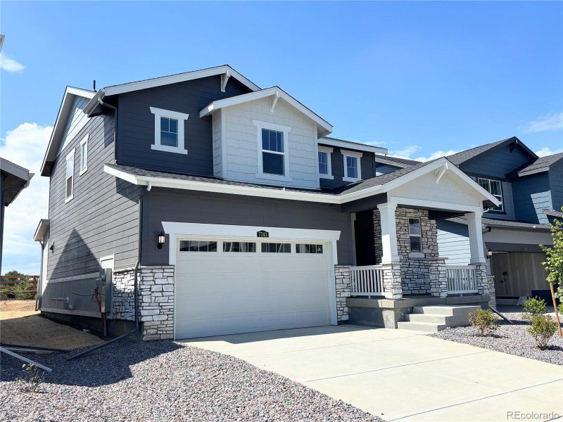 Front exterior of a new home in Vermilion Creek: The Pioneer Collection, Centennial, CO, highlighting curb appeal (Image 13).