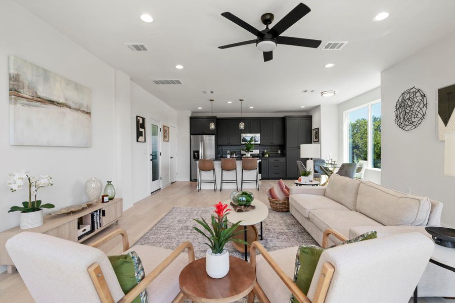 Living area featuring recessed lighting, light wood-style floors, and ceiling fan