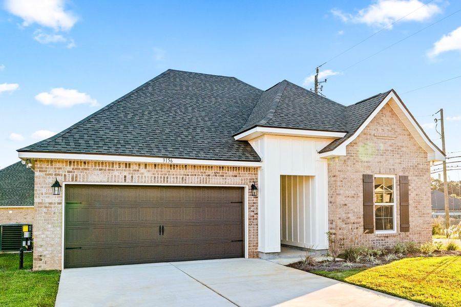 Front exterior of a new home in Eagle Pointe, Pensacola, FL, highlighting curb appeal (Image 19). Front exterior of a new home in Eagle Pointe, Pensacola, FL, highlighting curb appeal (Image 19).