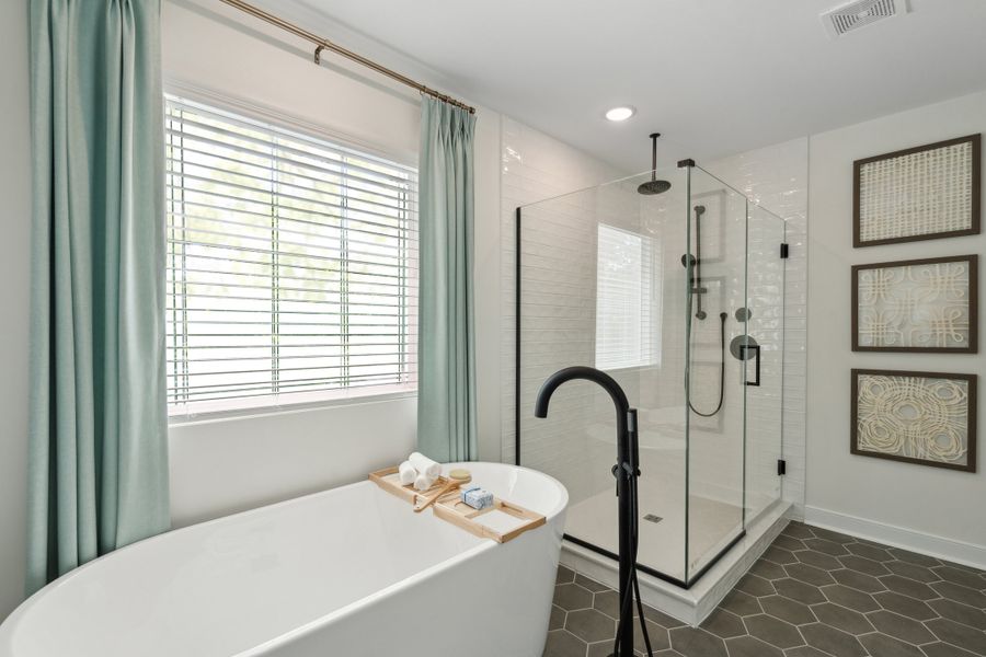 Primary bath with freestanding tub & glass shower enclosure