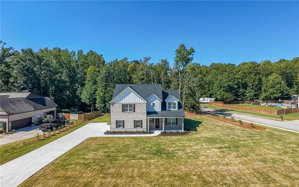 Front exterior of a new home in , McDonough, GA, highlighting curb appeal (Image 20). Front exterior of a new home in , McDonough, GA, highlighting curb appeal (Image 20).
