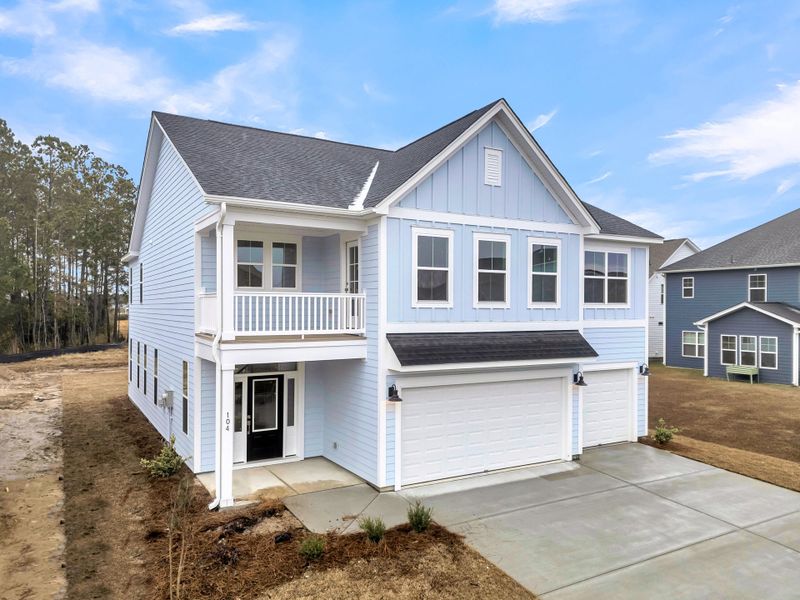 Front exterior of a new home in Hewing Farms, Summerville, SC, highlighting curb appeal (Image 27).