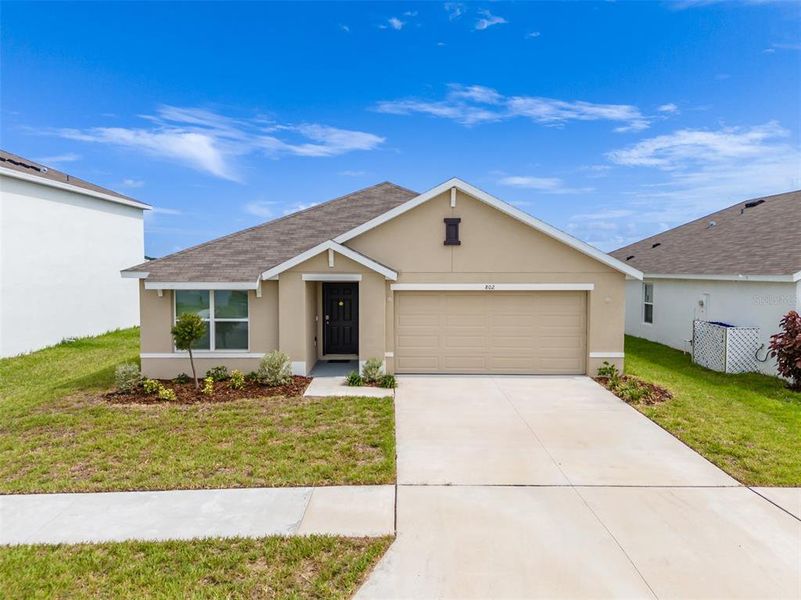 Front exterior of a new home in Brookside, Ruskin, FL, highlighting curb appeal (Image 22). Front exterior of a new home in Brookside, Ruskin, FL, highlighting curb appeal (Image 22).