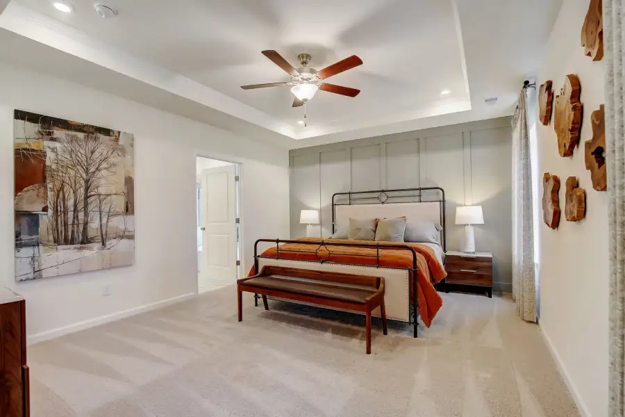 The Palmer- First Floor Primary Suite. The sample image is a staged model, to be used for illustrative purposes only. Upgrades, options, and colors will vary.